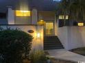 Inviting front exterior with updated lighting and easy access to the entrance at 18 Canvas Back Cove # 122, Georgetown, SC 29440