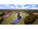 Beautiful aerial view showcasing a luxurious golf course community with a central clubhouse and water features at 223 Atlantic Breeze St., Myrtle Beach, SC 29572