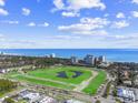 Scenic aerial view of green golf course with ocean view and resort buildings, showcasing the coastal lifestyle at 223 Atlantic Breeze St., Myrtle Beach, SC 29572
