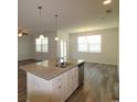 Modern kitchen featuring a center island with granite countertops and stainless steel appliances at 2681 Ophelia Way, Myrtle Beach, SC 29577
