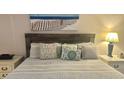 Cozy bedroom with beach theme decor, bedside tables and lamps at 2801 S Ocean Blvd. # 1535, North Myrtle Beach, SC 29582