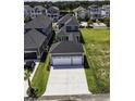 Home with three car garage featuring a long concrete driveway at 287 West Palms Dr., Myrtle Beach, SC 29579