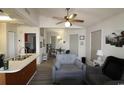 Open-concept living space featuring updated ceiling fan and views into kitchen and dining area at 423 Tree Top Ct. # 23-B, Myrtle Beach, SC 29588