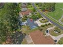 An aerial perspective of the home's backyard including a private deck area and mature trees at 4709 National Dr., Myrtle Beach, SC 29579