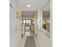 View of a condo's entryway leading to the living area and ocean views beyond at 4719 S Ocean Blvd. # 108, North Myrtle Beach, SC 29582