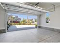 Clean, spacious garage with an open door, offering ample parking and storage space at 6850 Belancino Blvd., Myrtle Beach, SC 29579