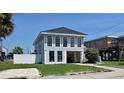Two-story beach house with a small yard and beach access at 710 S Waccamaw Dr., Garden City Beach, SC 29576