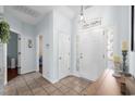 Bright foyer with tile floors, a decorative chandelier, and an elegant entryway at 755 Wintercreeper Dr., Longs, SC 29568