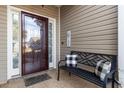 Cozy front porch with a decorative bench and a view of the home's exterior at 755 Wintercreeper Dr., Longs, SC 29568
