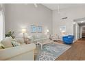 Bright living room boasts high ceilings, cozy seating, and stylish decor at 800 9Th Ave. S # N-1, North Myrtle Beach, SC 29582