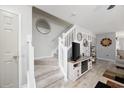 Modern living room featuring a staircase, neutral walls, and stylish decor at 807 Wilshire Ln. # 807, Murrells Inlet, SC 29576
