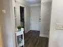 Bright foyer with hardwood floors, neutral walls and decorative console table and decor at 812 S Ocean Blvd. # B-3, Surfside Beach, SC 29575