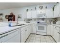 Bright kitchen featuring white cabinetry and essential appliances at 1058 Sea Mountain Hwy. # 10-101, North Myrtle Beach, SC 29582