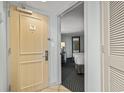 Entryway with a door leading into a hotel room featuring two beds, a nightstand, and carpet at 107 S Ocean Blvd. # 503, Myrtle Beach, SC 29577