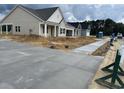 Street view showcasing new homes in a developing community, ready for landscaping at 119 Westfield Circle, Conway, SC 29526