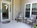Cozy front porch with comfortable seating and plants, perfect for relaxing at 1307 Carolina Wren Ln., Murrells Inlet, SC 29576