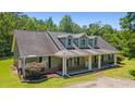 Inviting exterior view of the home highlighting the covered front porch and well-maintained landscaping at 140 Pixie Dust Ct., Myrtle Beach, SC 29588