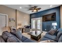 Inviting living room with ample seating, a mounted TV, and beach-themed decor at 1733 24Th Ave. N, North Myrtle Beach, SC 29582