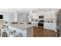 Modern kitchen featuring stainless steel appliances, a spacious island, and sleek white cabinetry at 222 Atlantic Breeze St., Myrtle Beach, SC 29572