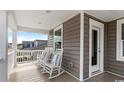 Inviting porch with rocking chairs, perfect for relaxing outdoors at 222 Atlantic Breeze St., Myrtle Beach, SC 29572