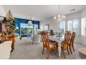 Charming dining room and living room combo with access to the screened balcony at 4400 Turtle Ln. # 2-D, Little River, SC 29566