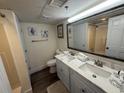 Bright bathroom with a double sink vanity and decorative seashell accents at 4800 S Ocean Blvd. # 706, North Myrtle Beach, SC 29582