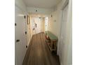 Inviting hallway with tile floors and a stylish decorative bench at 4800 S Ocean Blvd. # 706, North Myrtle Beach, SC 29582