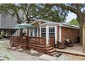 Exterior view of home featuring a wooden deck and stylish patio furniture at 6001 - 1040 S Kings Hwy., Myrtle Beach, SC 29575