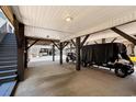 Covered parking area under elevated home, accommodating multiple golf carts at 6001-1010 S Kings Highway, Myrtle Beach, SC 29575
