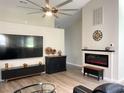 Bright living room with fireplace, large TV, and ample space for relaxation and entertainment at 620 Bathurst Dr., Myrtle Beach, SC 29579