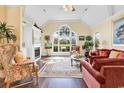 Inviting living room with hardwood floors, fireplace, and ample natural light at 765 Shaftesbury Ln., Conway, SC 29526