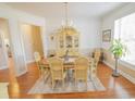 Formal dining room with hardwood floors, chandelier, and neutral decor at 1427 Mcmaster Dr., Myrtle Beach, SC 29575