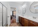 Well-lit bathroom with double sink vanity, and a shower with glass doors at 221 Rivers Edge Dr., Conway, SC 29526