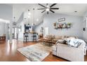 Spacious living room with hardwood floors, vaulted ceilings, and modern décor at 221 Rivers Edge Dr., Conway, SC 29526