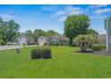 Beautiful single-story home with a well-maintained lawn, mature landscaping, and a paved driveway at 4539 Fringetree Dr., Murrells Inlet, SC 29576