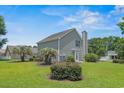 Charming home with well-maintained lawn and lush landscaping at 4539 Fringetree Dr., Murrells Inlet, SC 29576
