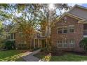 Charming brick condo building with mature trees, offering a warm and inviting curb appeal at 4645 Fringetree Dr. # 10B, Murrells Inlet, SC 29576