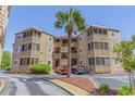 Charming condo building with exterior staircases and beautiful landscaping at 609 Hillside Dr. S # D-17, North Myrtle Beach, SC 29582