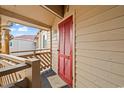 Private porch with red door featuring a shuttered design at 609 Hillside Dr. S # D-17, North Myrtle Beach, SC 29582