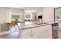 Open-concept kitchen featuring an island, stainless steel appliances, and a seamless flow to the dining and living areas at 1394 Nokota Dr., Conway, SC 29526