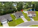 Aerial view of a home in a Gathering-friendly neighborhood with mature trees and a nearby pond at 216 Palm Terrace Loop, Conway, SC 29526