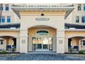 Inviting building entrance with covered archway, glass doors and a sign that says, Edgewater 7 at 2180 Waterview Dr. # 721, North Myrtle Beach, SC 29582