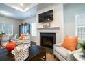 Living room features a fireplace with a TV and lots of natural light at 640 Mccorkle Place, Conway, SC 29526