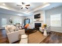 Cozy living room with fireplace, ceiling fan, and lots of natural light at 640 Mccorkle Place, Conway, SC 29526
