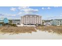 Stunning building with beach access surrounded by lush landscape for a great view at 817 S Ocean Blvd. # 201, North Myrtle Beach, SC 29582