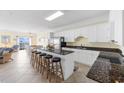 Gourmet kitchen featuring granite countertops, a large island, and modern stainless steel appliances at 817 S Ocean Blvd. # 201, North Myrtle Beach, SC 29582