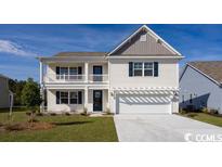 Charming two-story home featuring white siding, black shutters, and a welcoming front porch at 8891 Habersham Pl Se, Calabash, NC 28467