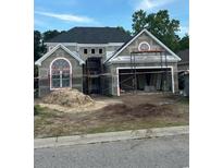New home construction featuring a two-story design, attached garage, and large windows at 5508 Via Verde Dr., North Myrtle Beach, SC 29582