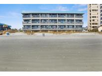 Oceanfront condo building featuring multiple floors of units with balconies and lovely beach views at 6000 N Ocean Blvd. # 131, North Myrtle Beach, SC 29582
