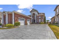 Stately brick home with a three-car garage and attractive landscaping at 816 Waterton Ave., Myrtle Beach, SC 29579